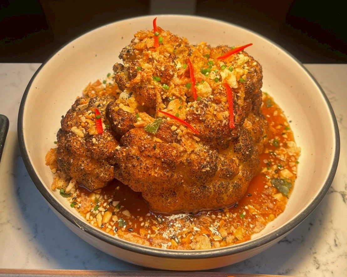 Roasted cauliflower glazed with tamarind, finished with nuts, herbs and chilli