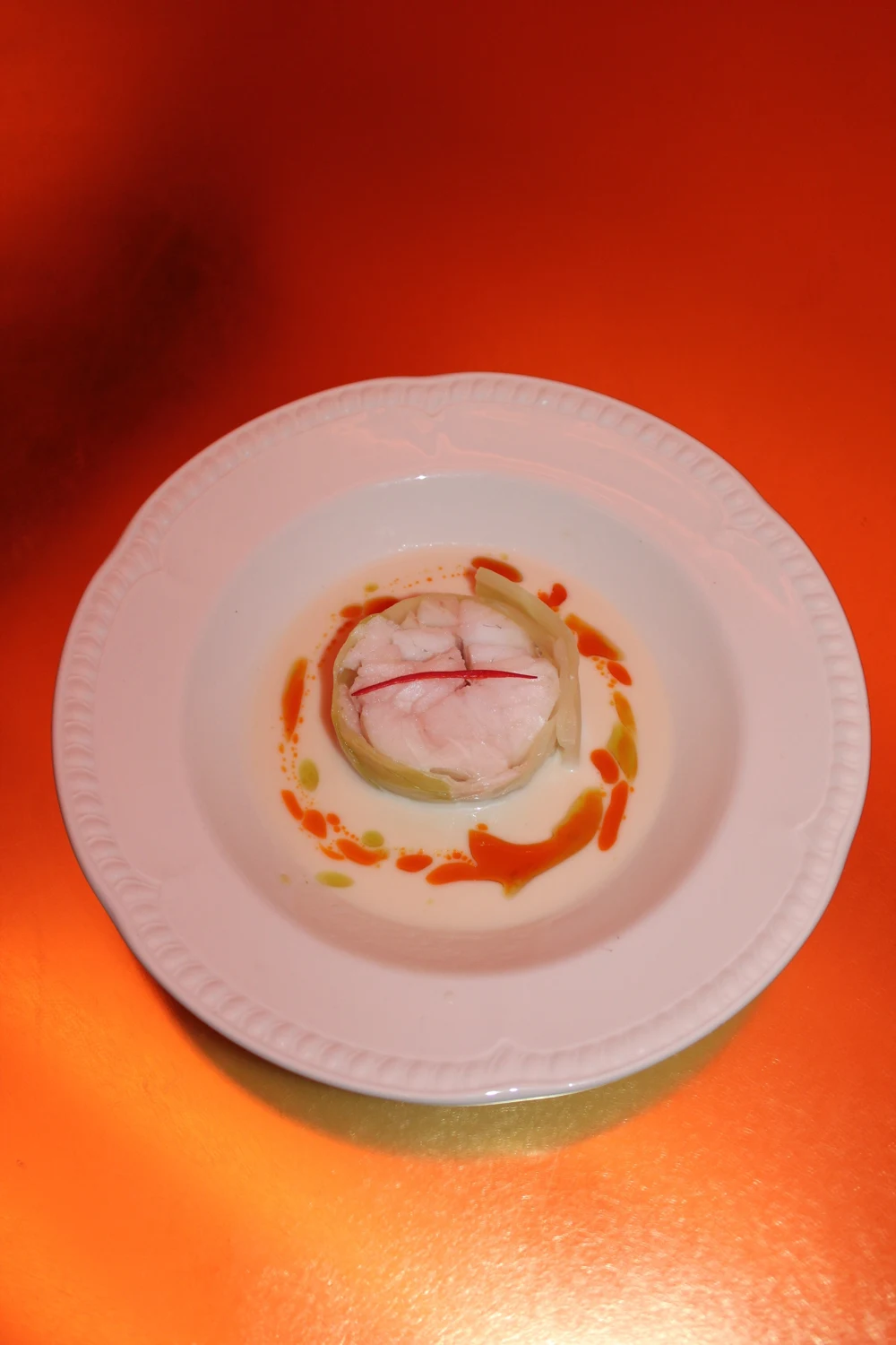 Murray cod roulade surrounded by tom kha foam and fragrant oil